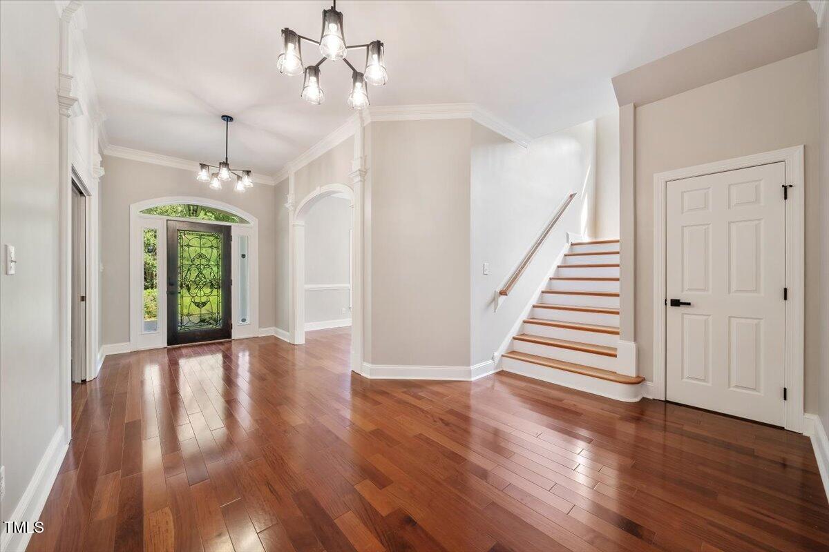 6300 Swallow Cove Lane Raleigh, NC 27614 - Photo 3 of 67 wooden floor in an empty room with a window
