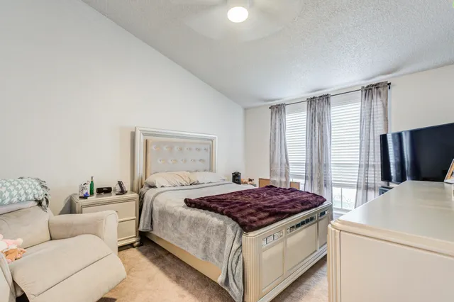 a bathroom with a shower a toilet and a sink