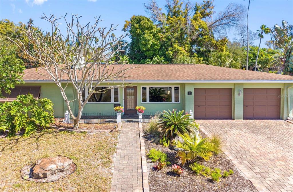 a front view of a house with garden