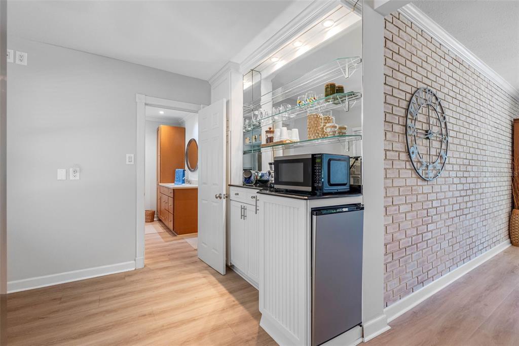 101 Osceola Road Belleair, FL 33756 - Photo 16 of 33 a kitchen with stainless steel appliances a refrigerator and microwave