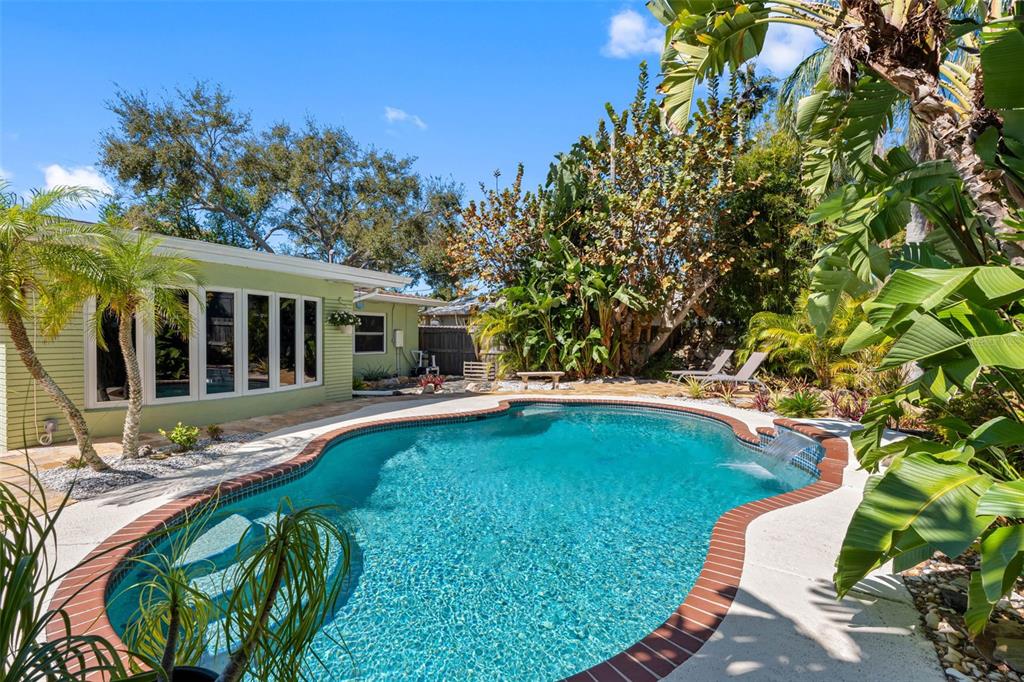 101 Osceola Road Belleair, FL 33756 - Photo 23 of 33 a swimming pool with outdoor seating and yard