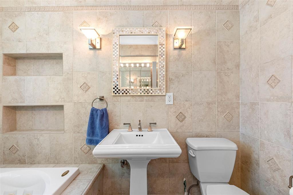 101 Osceola Road Belleair, FL 33756 - Photo 30 of 33 a bathroom with a sink a toilet and shower