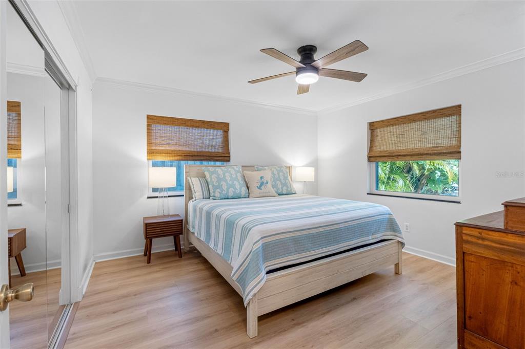 101 Osceola Road Belleair, FL 33756 - Photo 31 of 33 a bedroom with a bed and a painting on the wall