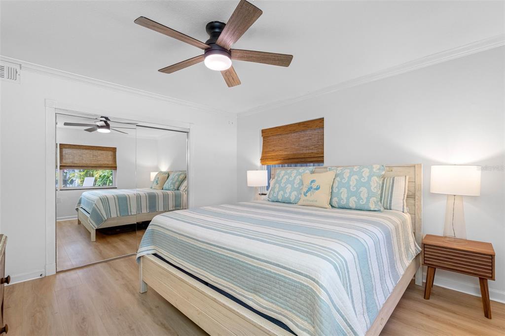 101 Osceola Road Belleair, FL 33756 - Photo 32 of 33 a bedroom with a bed a couch and a window