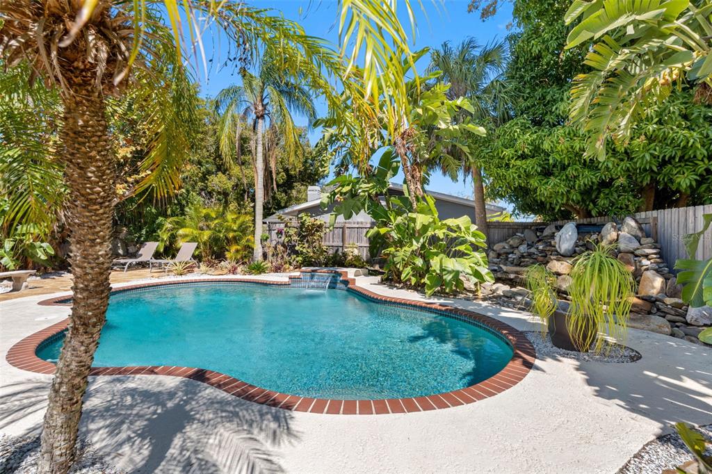 101 Osceola Road Belleair, FL 33756 - Photo 4 of 33 a view of a swimming pool with a patio