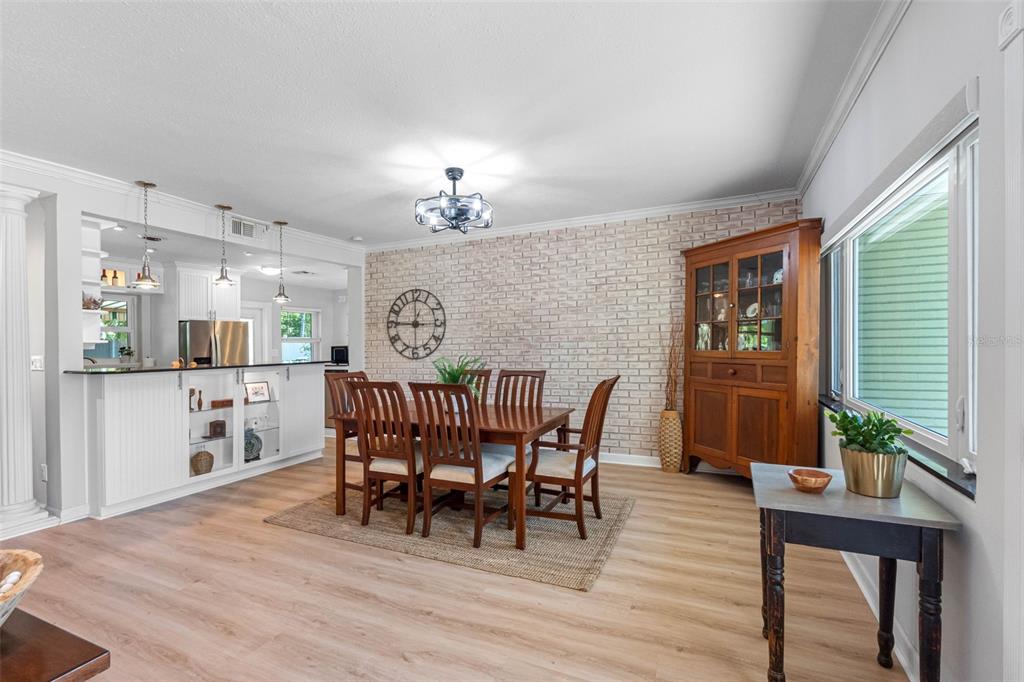 101 Osceola Road Belleair, FL 33756 - Photo 5 of 33 a view of a dining room with furniture and wooden floor