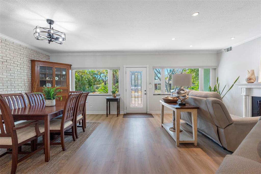 101 Osceola Road Belleair, FL 33756 - Photo 7 of 33 a view of a dining room with furniture window and wooden floor