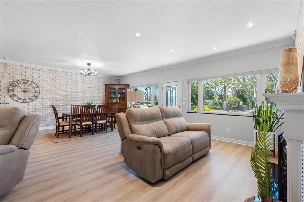 101 Osceola Road Belleair, FL 33756 - Photo 8 of 33 a living room with furniture and a large window