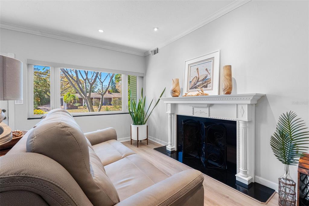 101 Osceola Road Belleair, FL 33756 - Photo 9 of 33 a living room with furniture and a fireplace