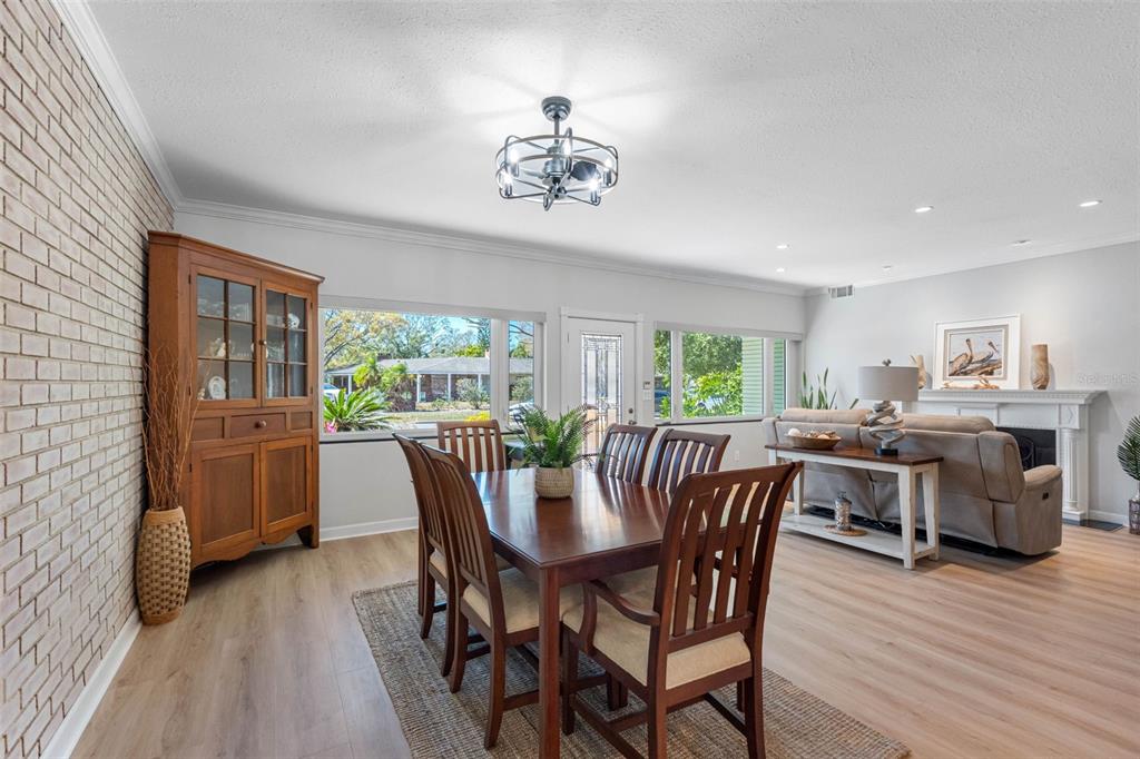 101 Osceola Road Belleair, FL 33756 - Photo 10 of 33 a view of a dining room with furniture window and wooden floor