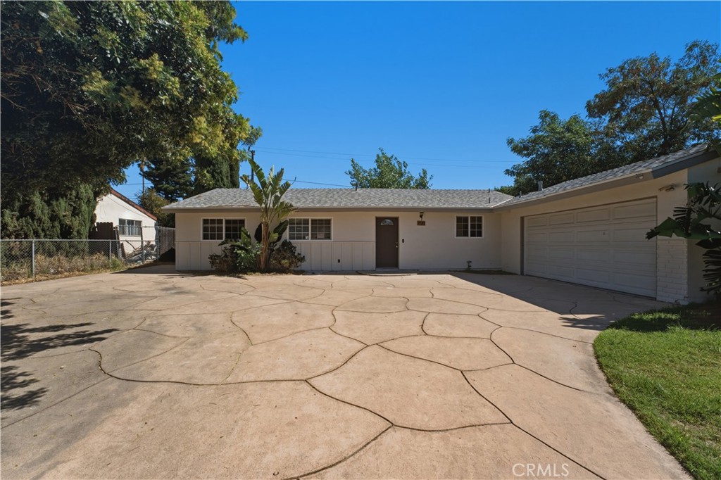 1720 Anderson Street Simi Valley, CA 93065 - Photo 2 of 30 a front view of a house with a yard