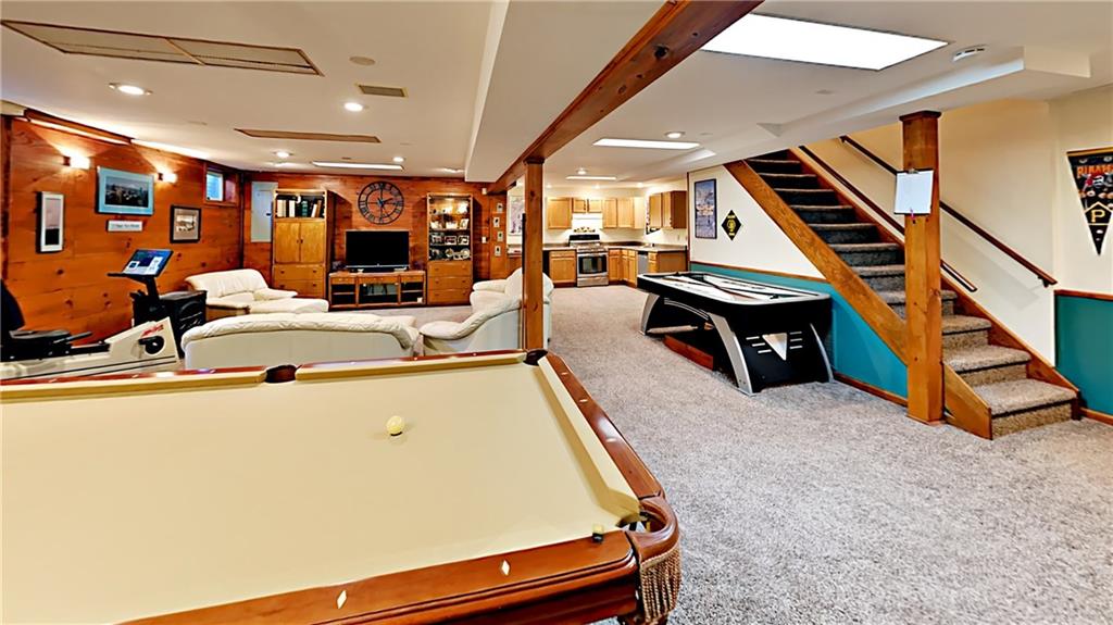 5766 Evans Road Export, PA 15632 - Photo 20 of 25 Expansive game room. Additional unfinished area offering an abundance of storage plus stairs up to 3 car attached garage.