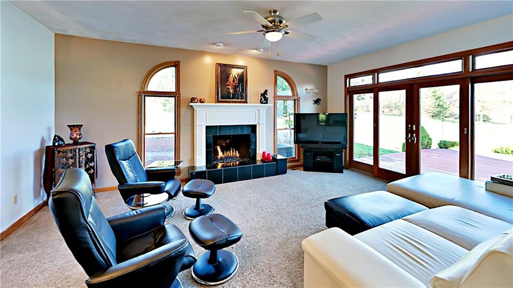 5766 Evans Road Export, PA 15632 - Photo 6 of 25 Spacious family room with gas fireplace and access to rear deck.