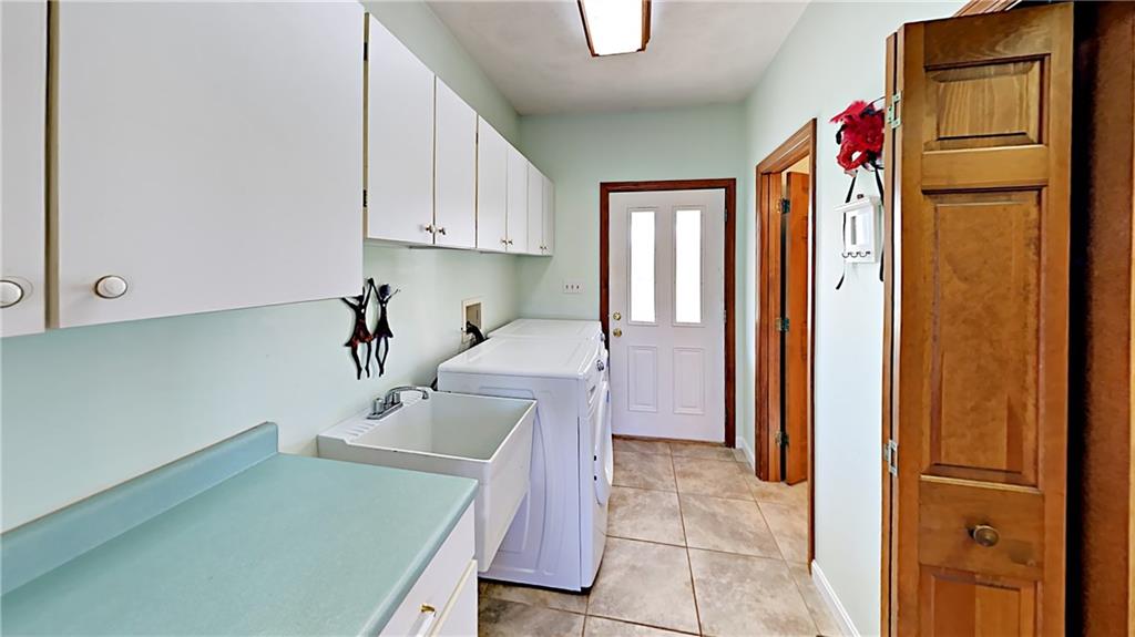 5766 Evans Road Export, PA 15632 - Photo 10 of 25 Main level laundry with 2nd walk-in pantry and 2nd powder room.
