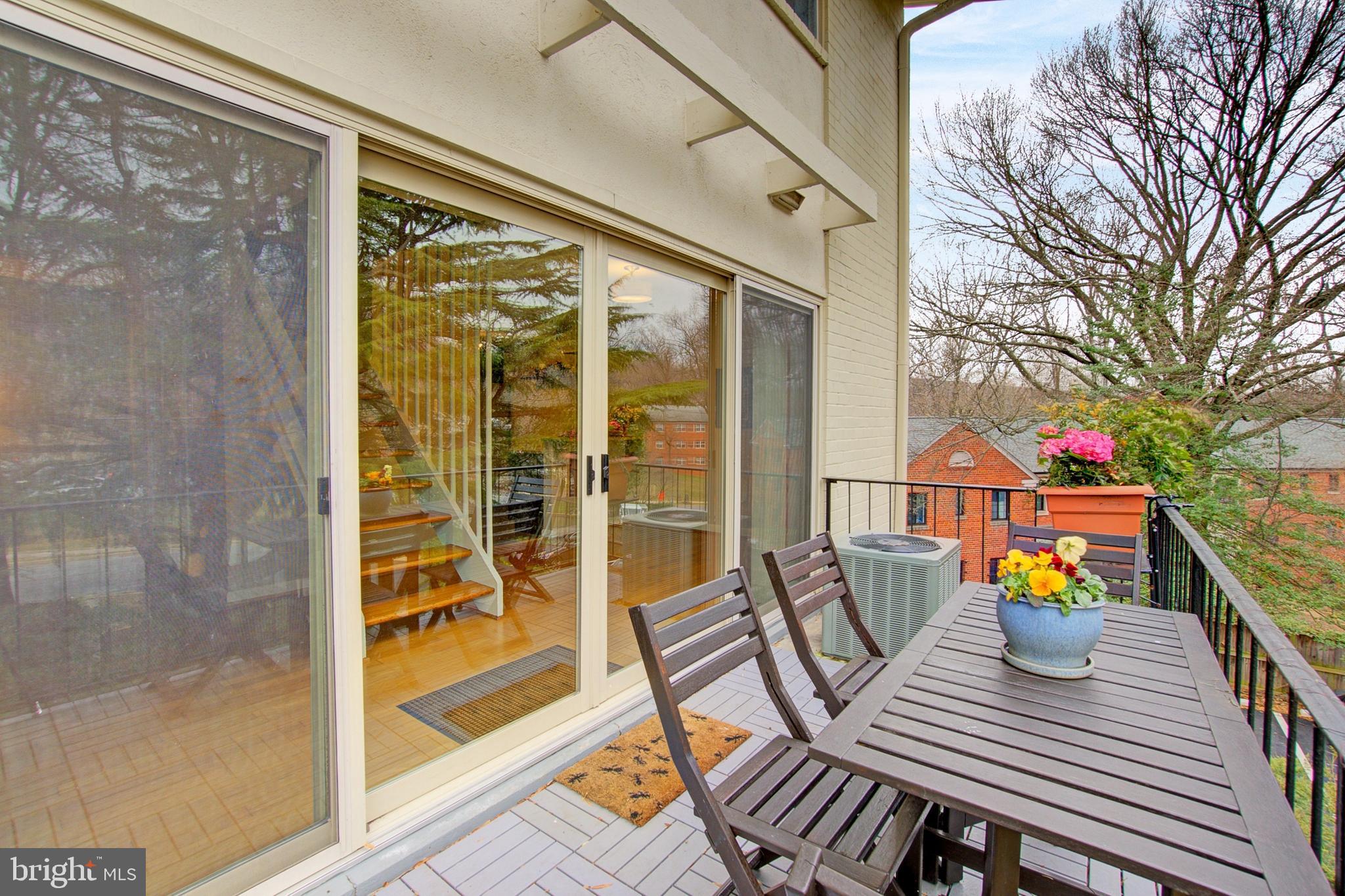 8706 Manchester Road, Unit 5 Silver Spring, MD 20901 - Photo 11 of 25 a view of a balcony with two chairs and a table