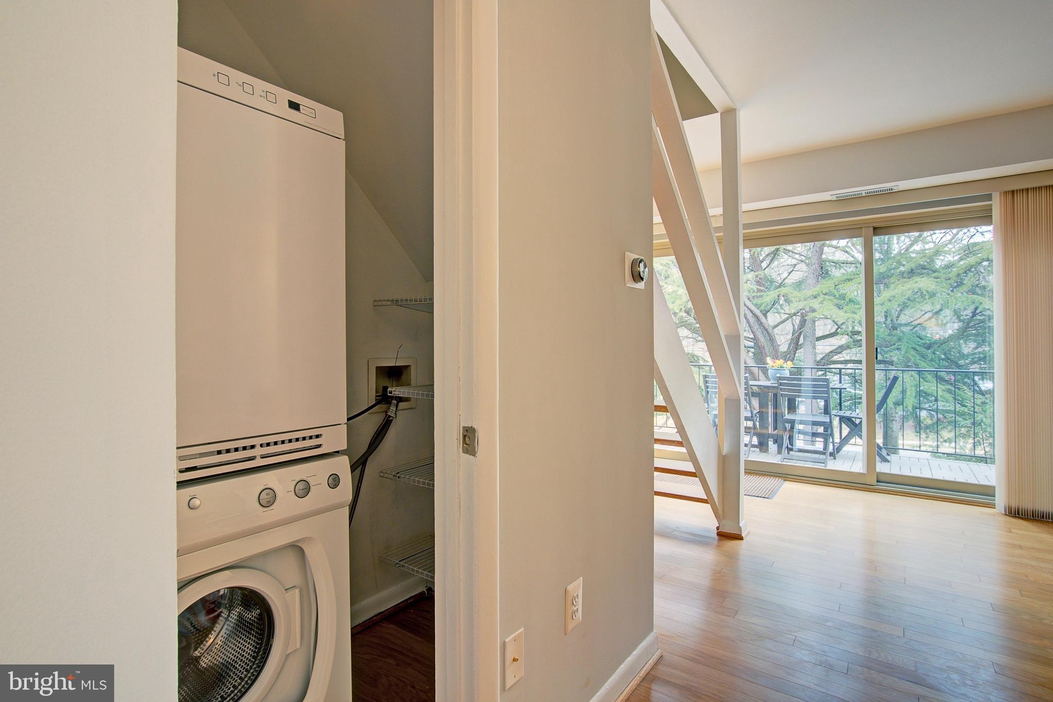 8706 Manchester Road, Unit 5 Silver Spring, MD 20901 - Photo 12 of 25 a view of a hallway with washer and dryer