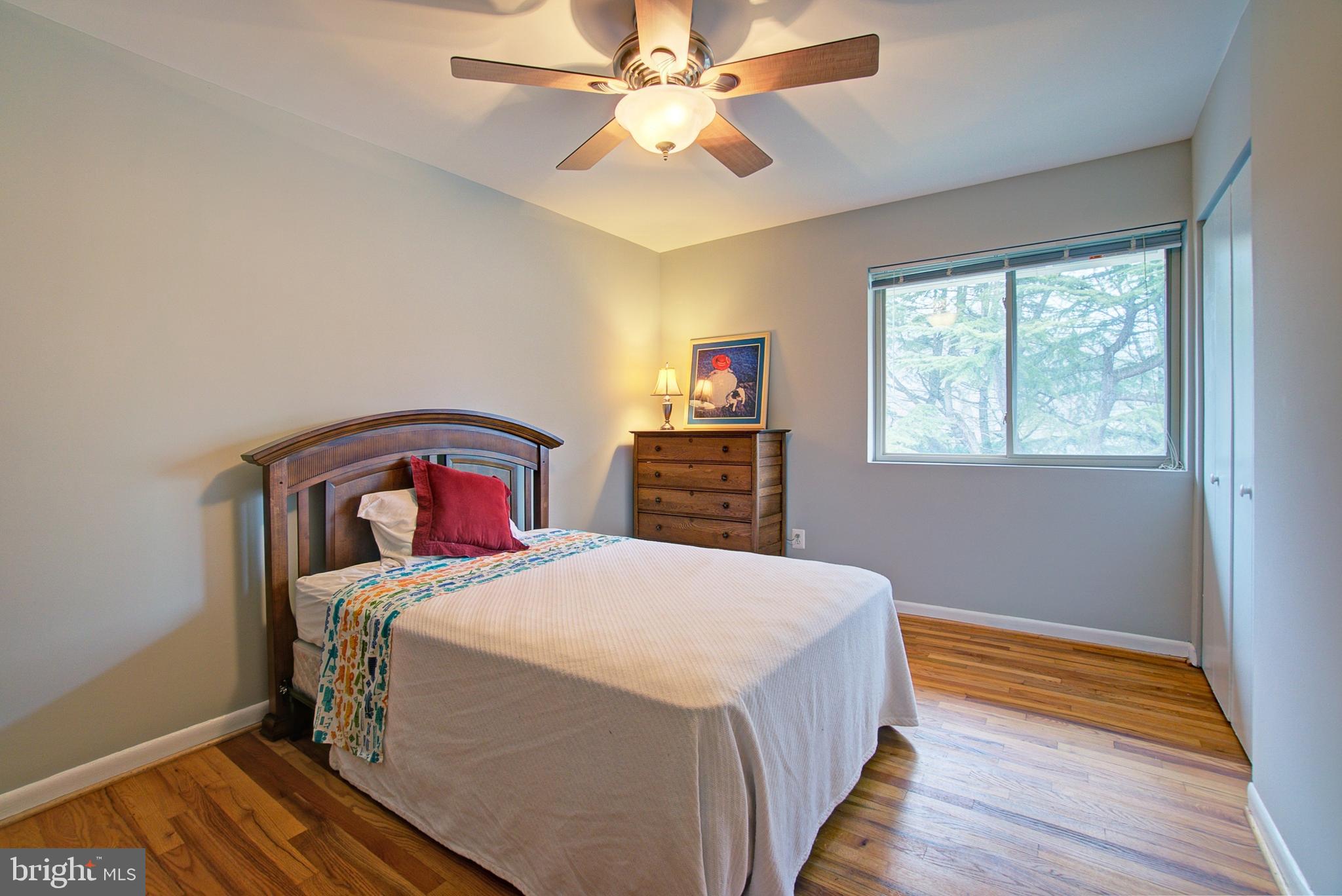 8706 Manchester Road, Unit 5 Silver Spring, MD 20901 - Photo 17 of 25 a bedroom with a bed and a window