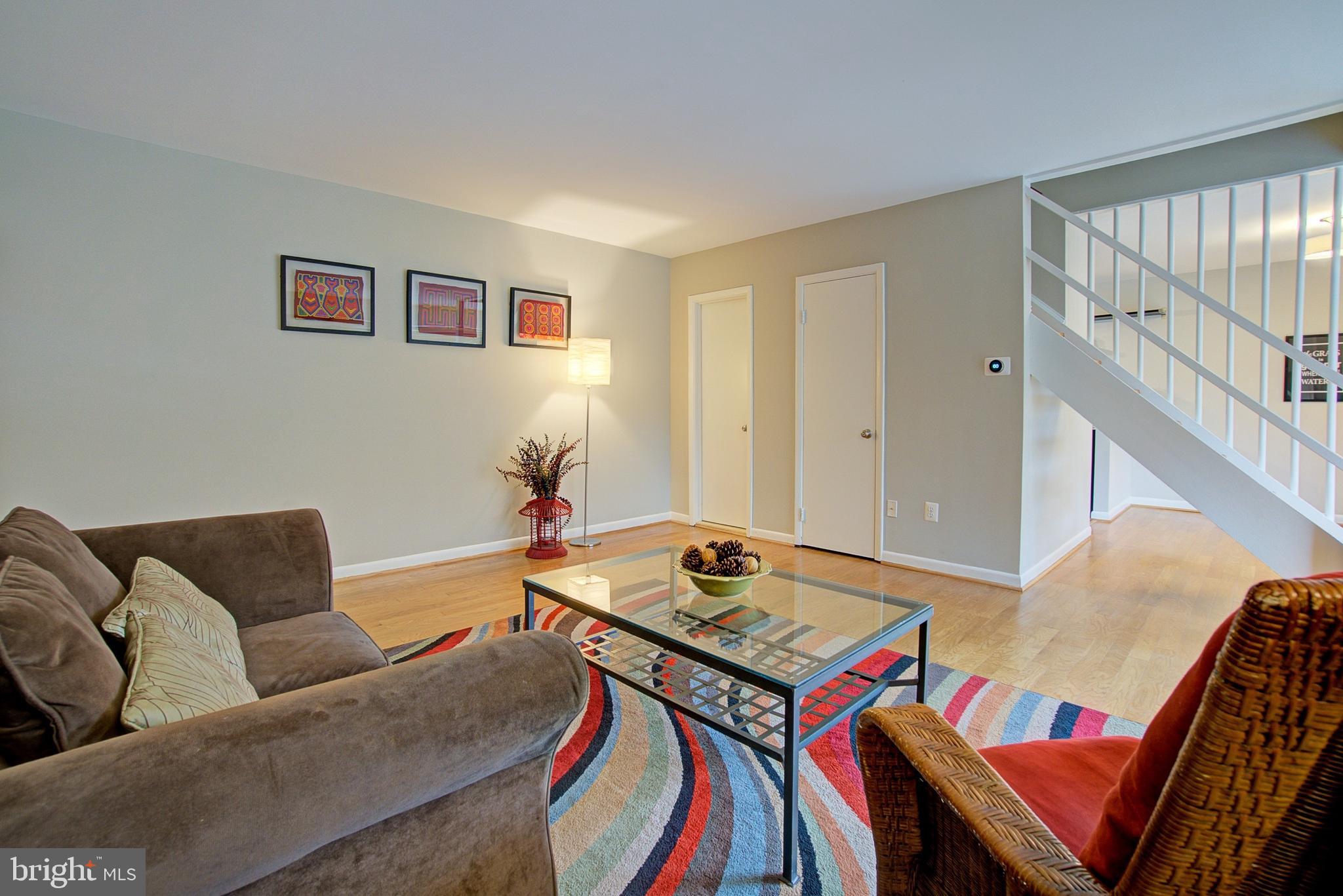 8706 Manchester Road, Unit 5 Silver Spring, MD 20901 - Photo 4 of 25 a living room with furniture and a table