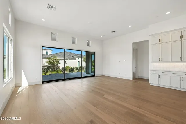 a stove top oven sitting inside of a kitchen