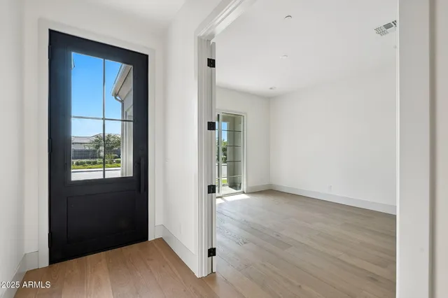 a kitchen with a sink stove top oven and cabinets