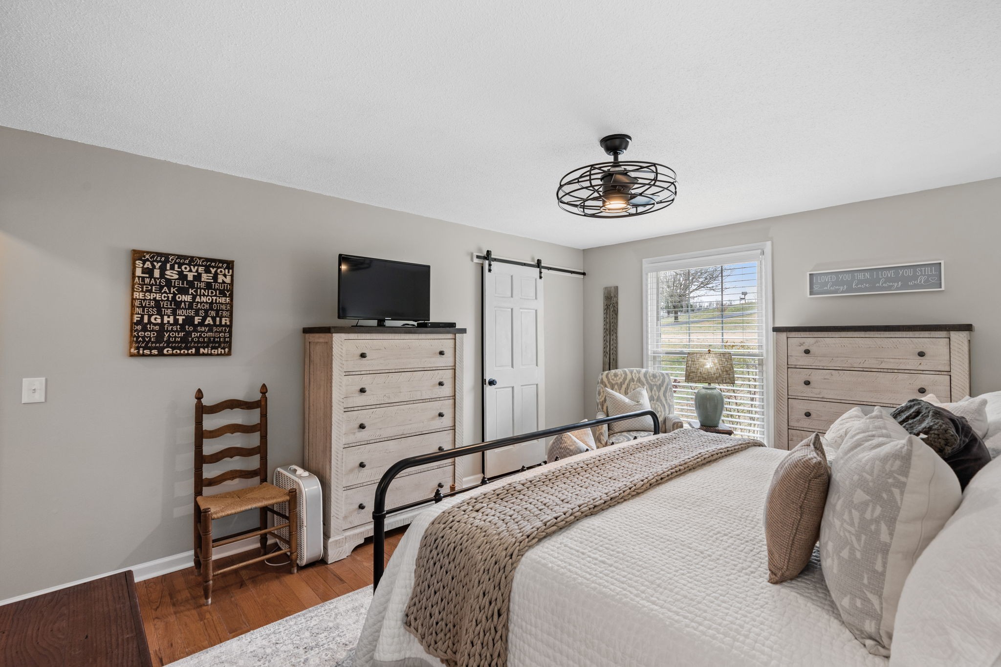 401 Bluegrass Court Lebanon, TN 37090 - Photo 21 of 51 a bedroom with a bed and a flat tv screen