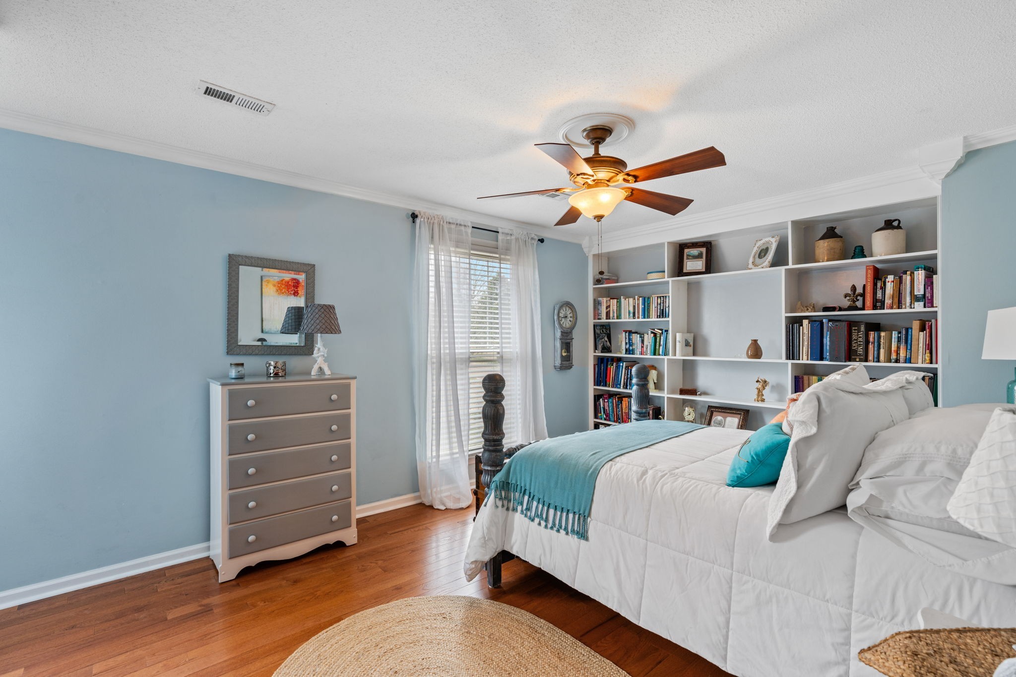 401 Bluegrass Court Lebanon, TN 37090 - Photo 24 of 51 a bedroom with a bed and a book shelf