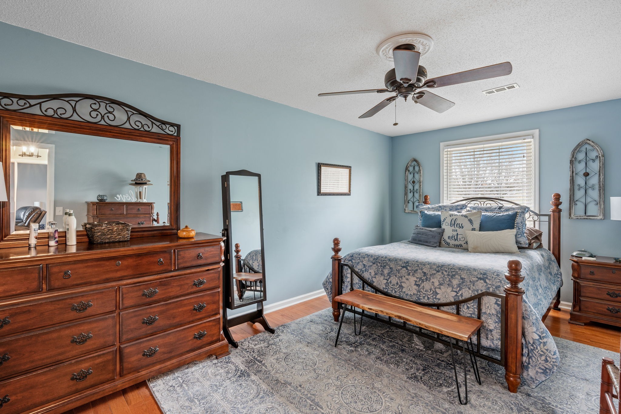401 Bluegrass Court Lebanon, TN 37090 - Photo 27 of 51 a bedroom with a bed and wooden floor