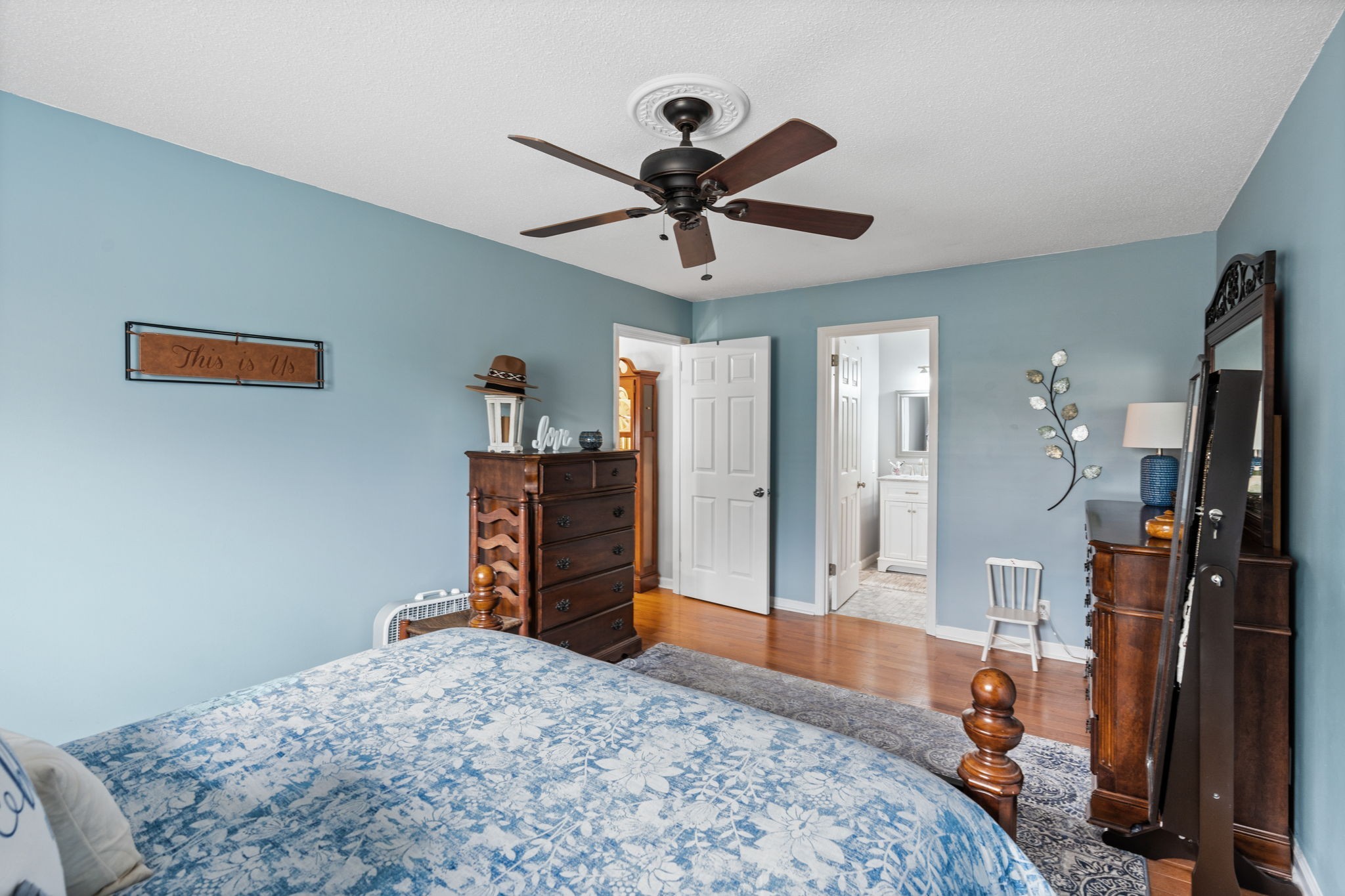 401 Bluegrass Court Lebanon, TN 37090 - Photo 28 of 51 a bedroom with a bed and a chandelier
