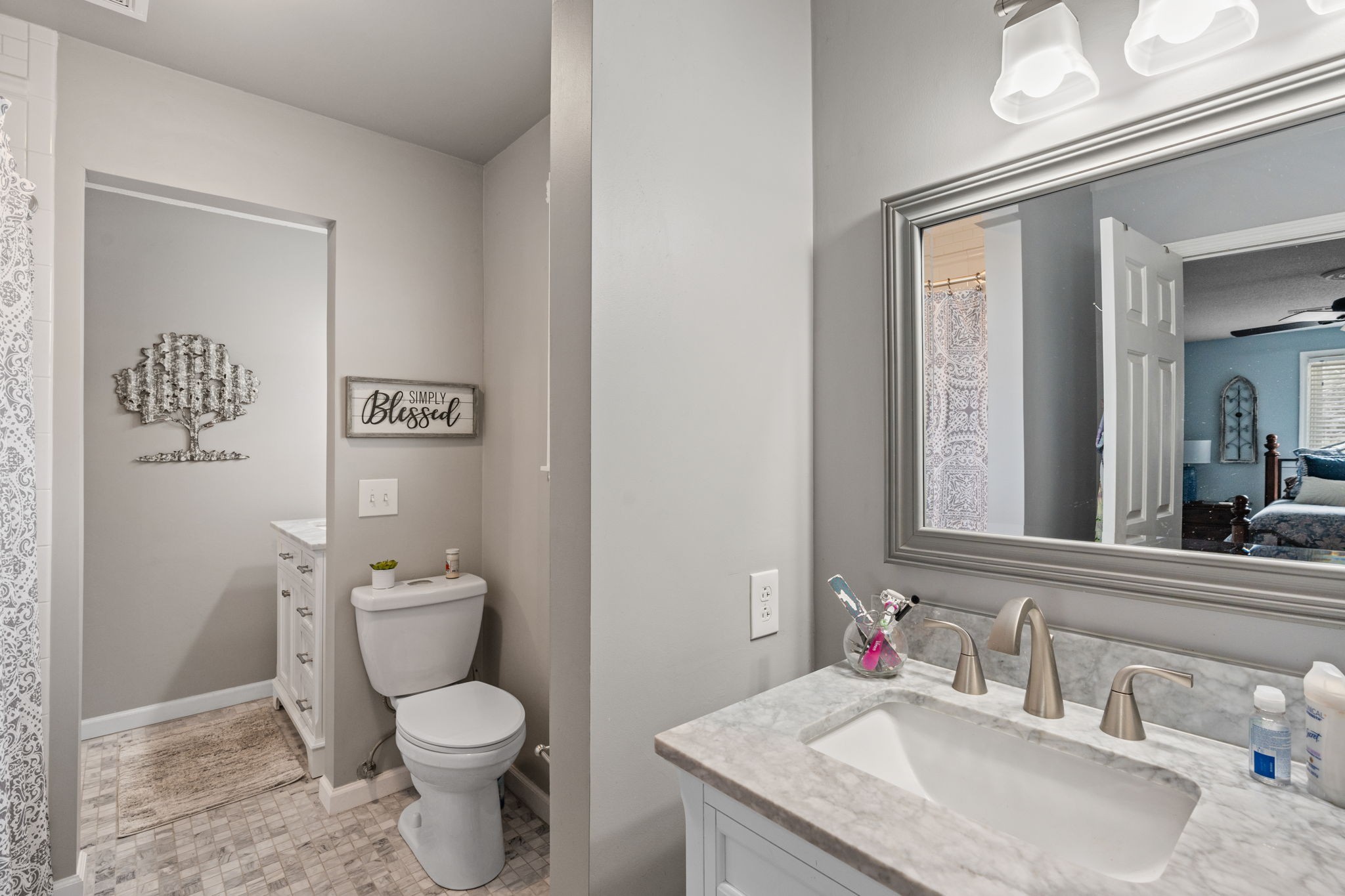 401 Bluegrass Court Lebanon, TN 37090 - Photo 31 of 51 a bathroom with a granite countertop toilet sink and mirror