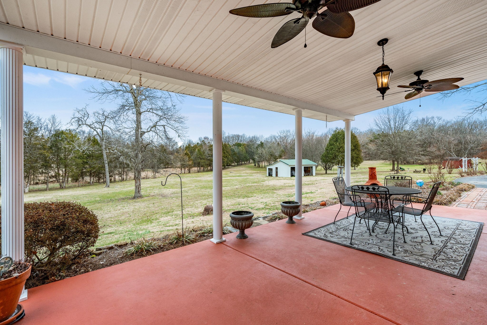 401 Bluegrass Court Lebanon, TN 37090 - Photo 34 of 51 a view of a patio with a table chairs and a backyard