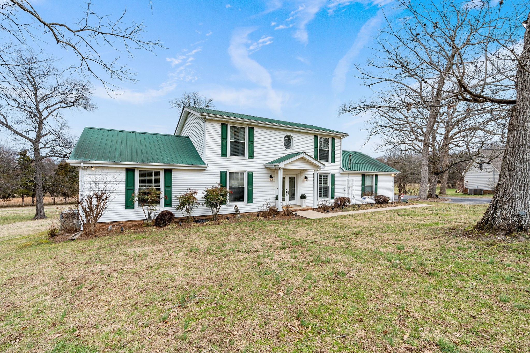 401 Bluegrass Court Lebanon, TN 37090 - Photo 5 of 51 a view of a house with a yard patio and fire pit