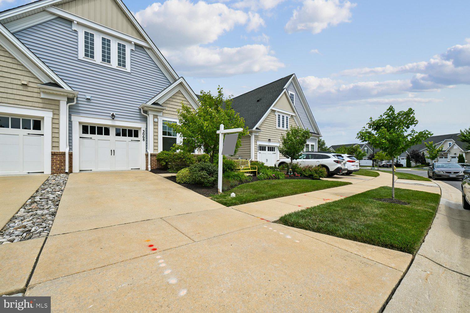 3068 Spring Peeper Court Odenton, MD 21113 - Photo 24 of 42 a front view of a house with garden