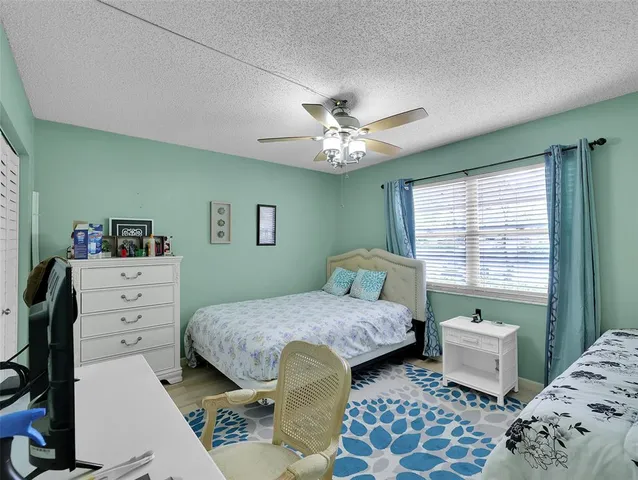 a bedroom with a bed and a view of bathroom
