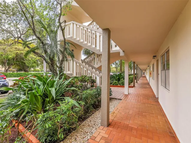 a view of a pathway both side of house