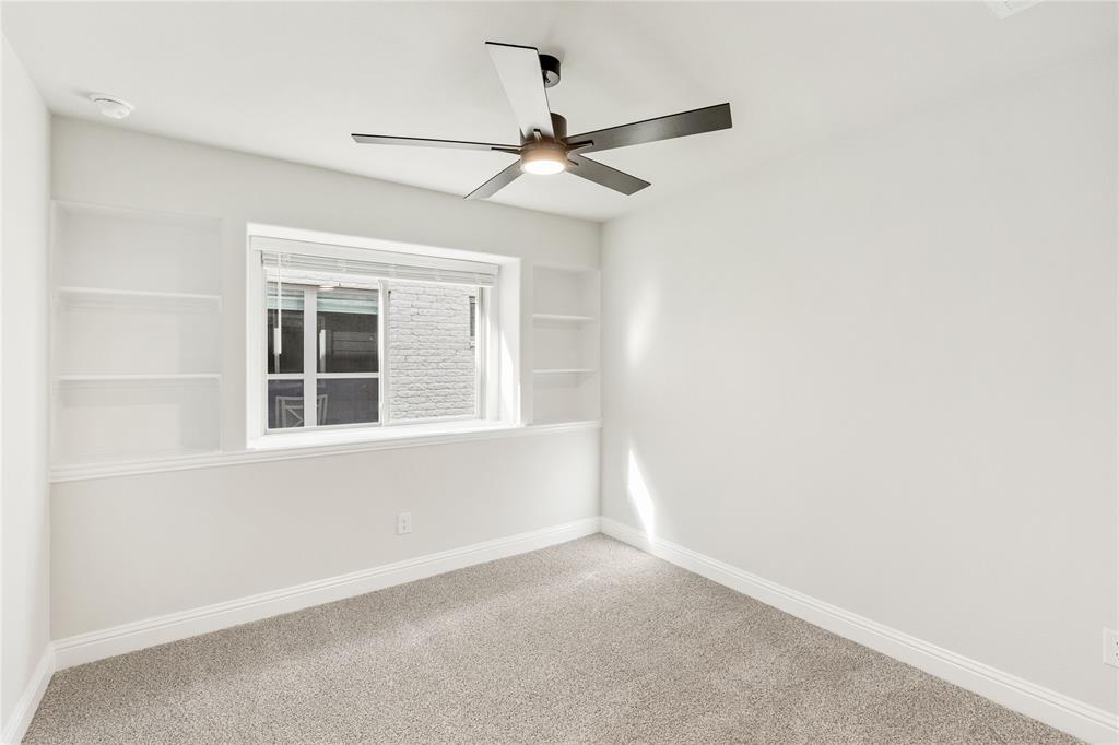 14505 Lovelace Street Pilot Point, TX 76258 - Photo 13 of 37 an empty room with a window and a fan