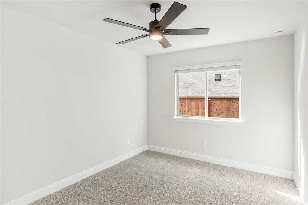14505 Lovelace Street Pilot Point, TX 76258 - Photo 14 of 37 an empty room with a window and a fan