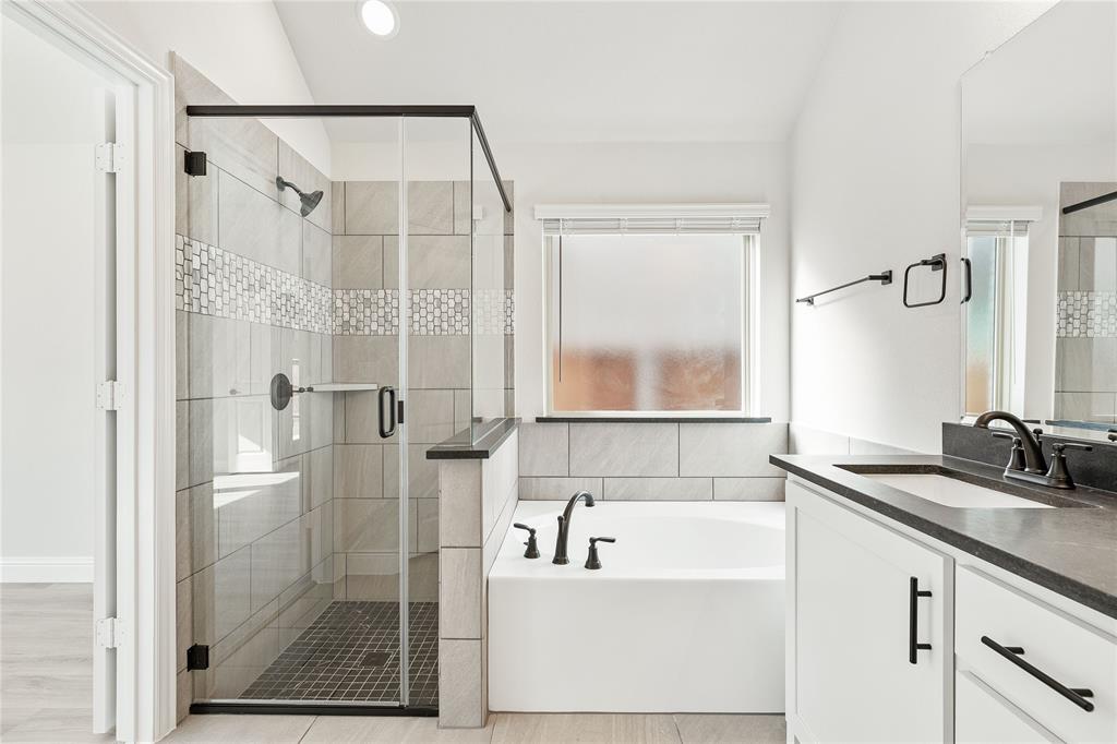 14505 Lovelace Street Pilot Point, TX 76258 - Photo 26 of 37 a bathroom with a granite countertop sink a shower and a mirror