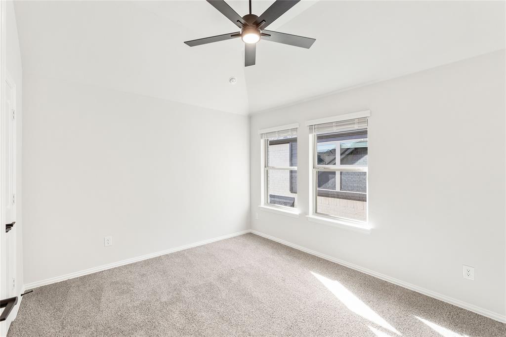 14505 Lovelace Street Pilot Point, TX 76258 - Photo 31 of 37 an empty room with a window and ceiling fan