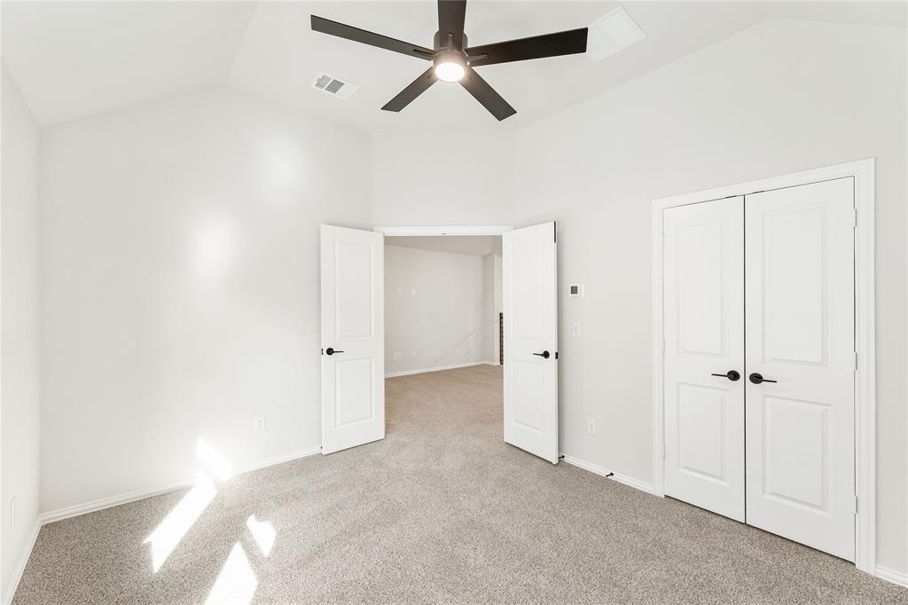 14505 Lovelace Street Pilot Point, TX 76258 - Photo 32 of 37 a view of a chandelier fan and closet in a room