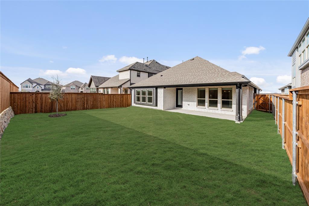 14505 Lovelace Street Pilot Point, TX 76258 - Photo 36 of 37 a front view of a house with yard