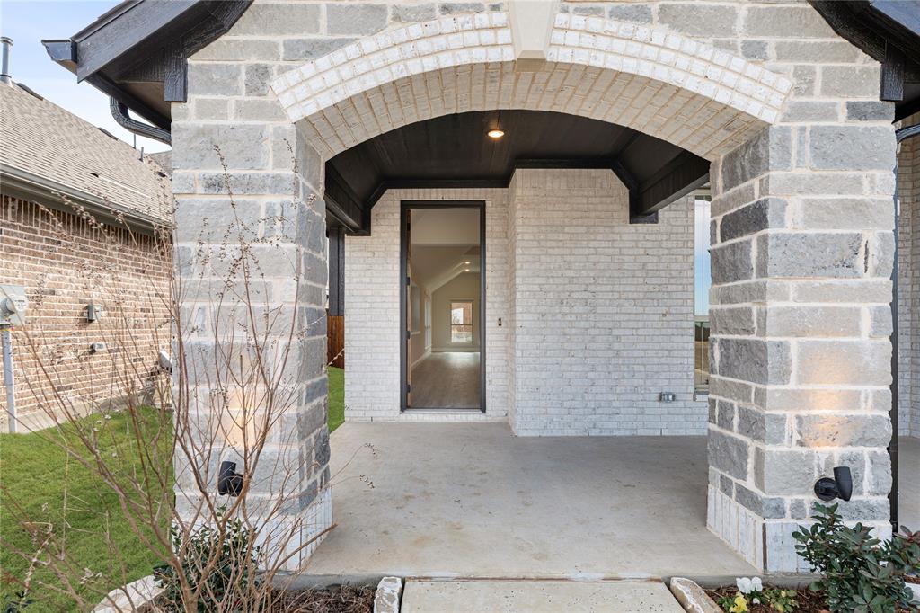 14505 Lovelace Street Pilot Point, TX 76258 - Photo 4 of 37 a picture of a door