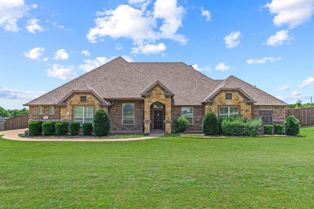 Full one-acre. All brick + stone.