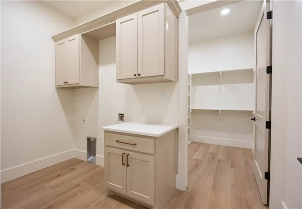 a view of cabinets with wooden floor and cabinet