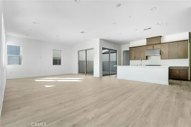 a view of a livingroom with furniture and wooden floor