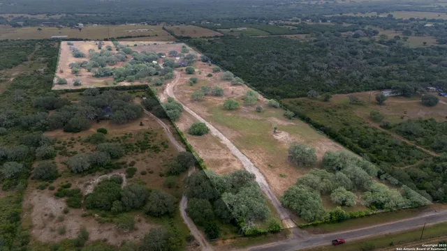 an aerial view of residential houses with outdoor space