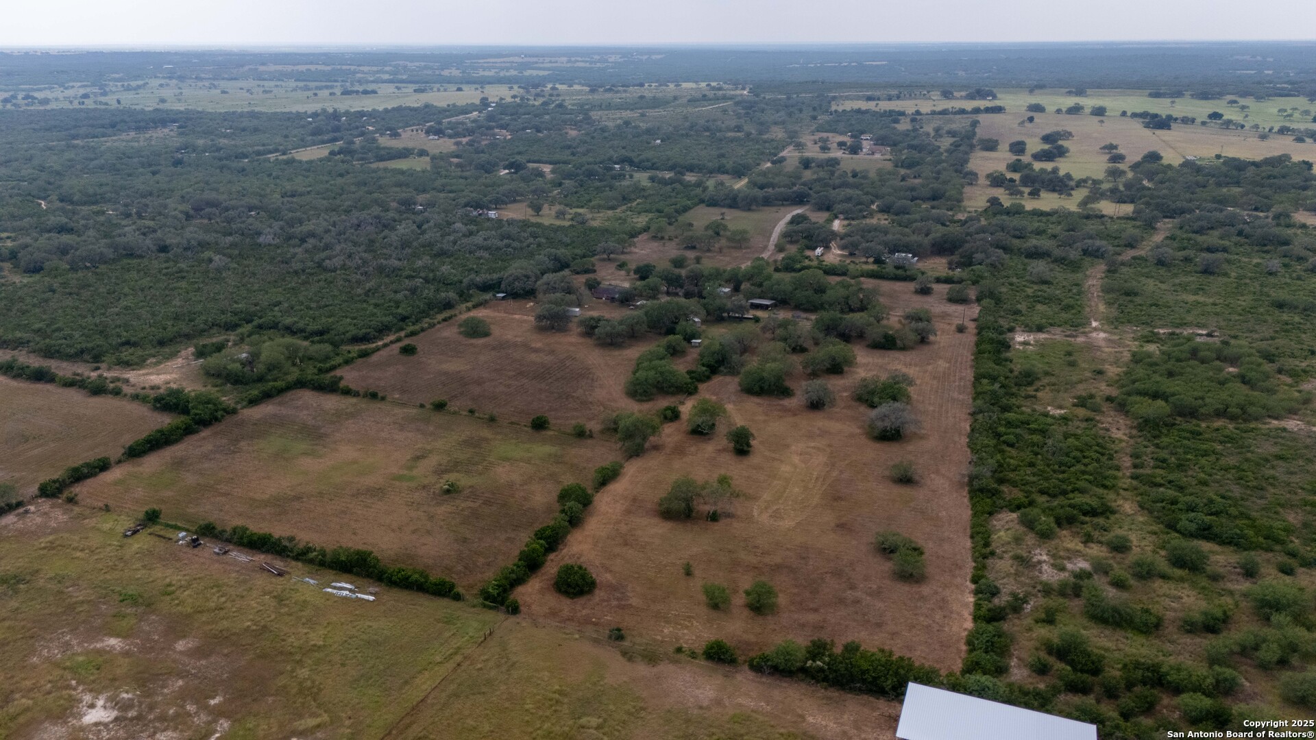 6242 Wildcat Drive Beeville, TX 78102 - Photo 10 of 15 an aerial view of a house with a mountain