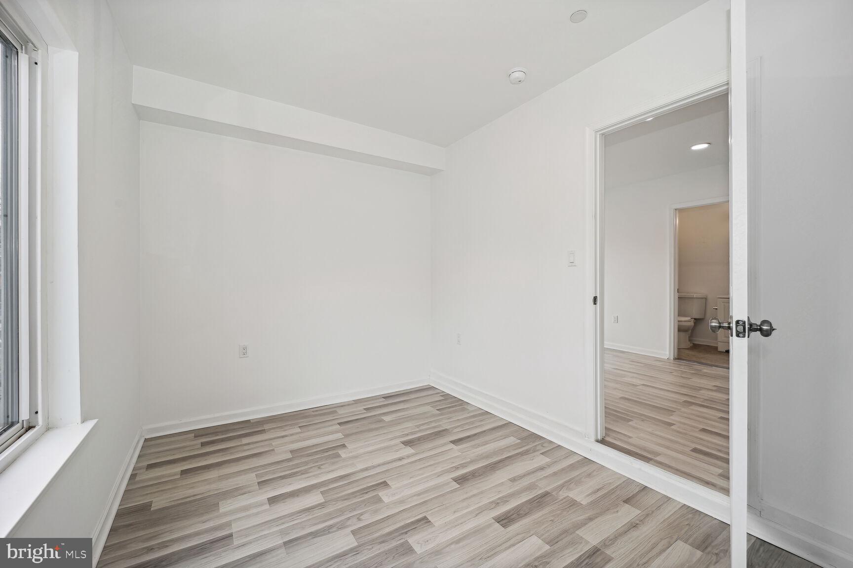 1642 16th Street Southeast, Unit 3 Washington, DC 20020 - Photo 17 of 22 a view of a room with wooden floor