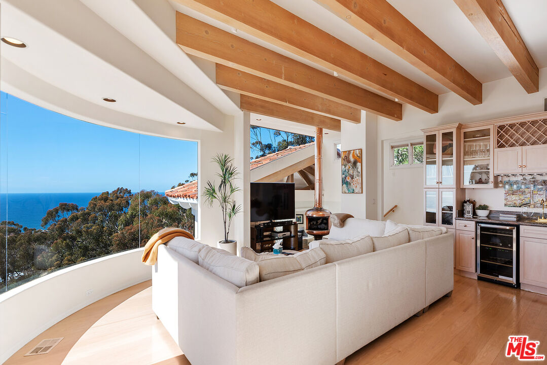 7350 Brodiaea Way La Jolla, CA 92037 - Photo 21 of 60 a living room with furniture and a flat screen tv