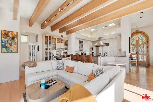 a bedroom with a bed a couch and dresser