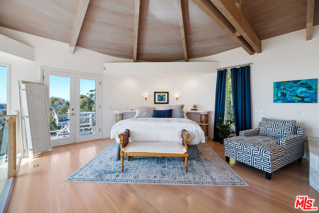 7350 Brodiaea Way La Jolla, CA 92037 - Photo 30 of 60 a bedroom with a bed a couch and dresser